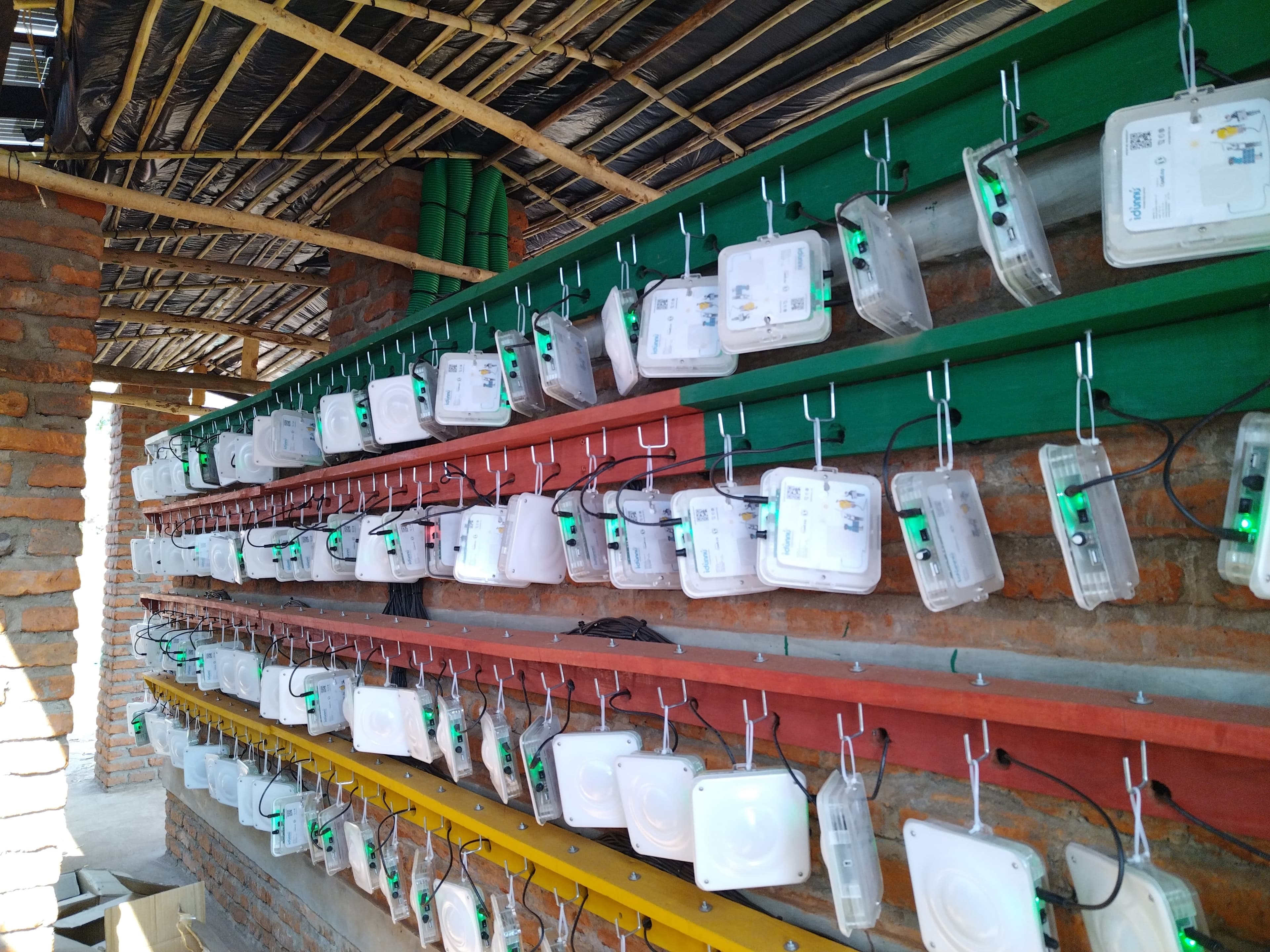 Rows of IDùnnú solar lanterns being prepared in a Quadloop workshop.