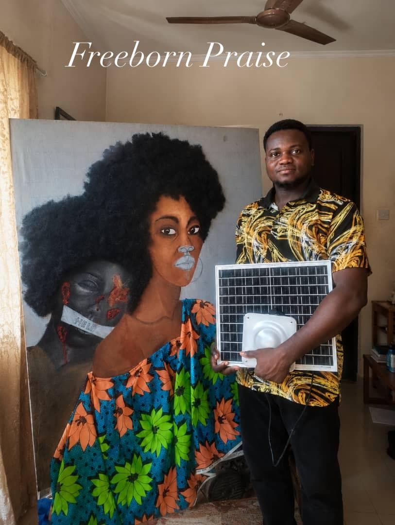 Artist Freeborn Praise with a Quadloop solar kit beside original portraits.