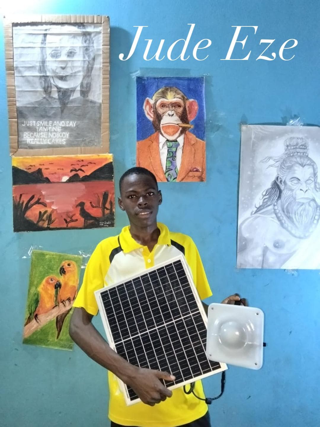 Artist Jude Eze with a Quadloop solar kit in his art space.