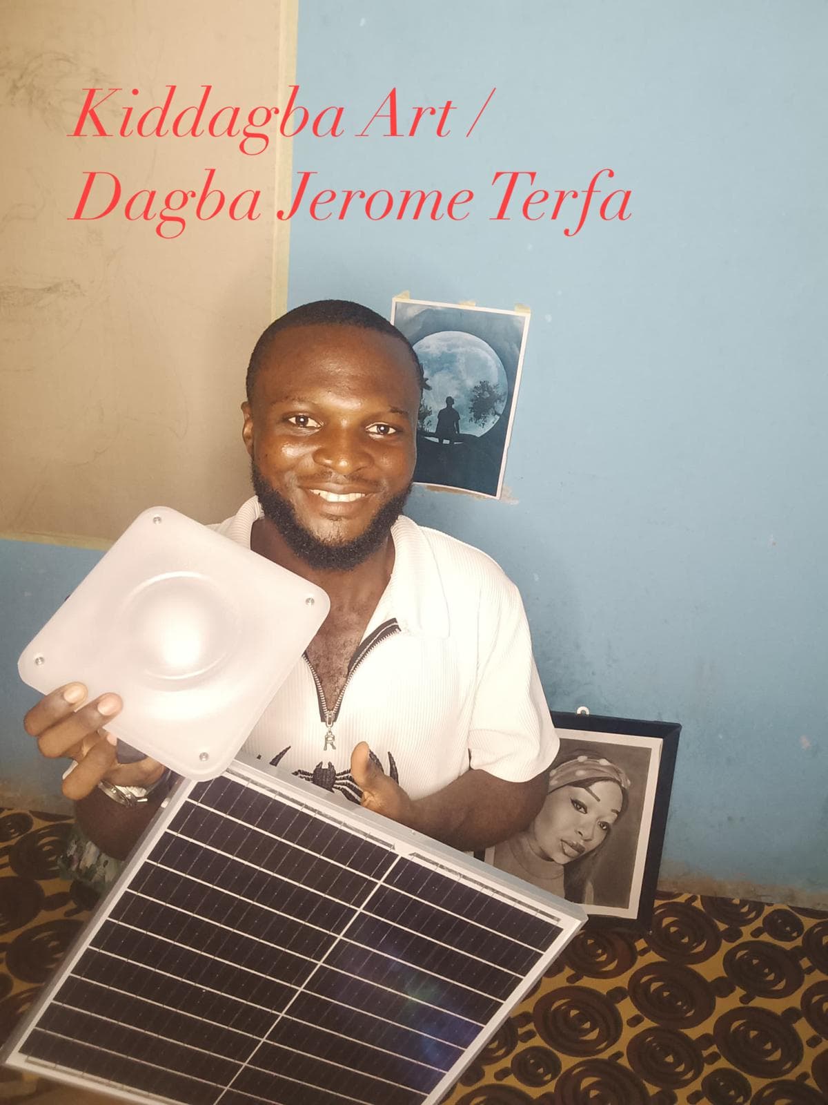 Artist Kiddagba Art with a Quadloop solar kit and original work.