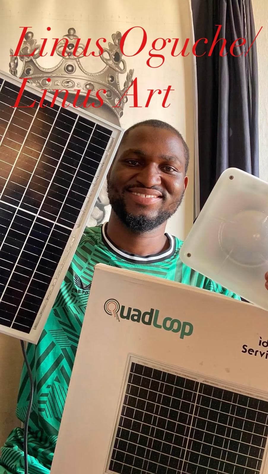 Artist Linus Oguche with a Quadloop solar kit in his studio.