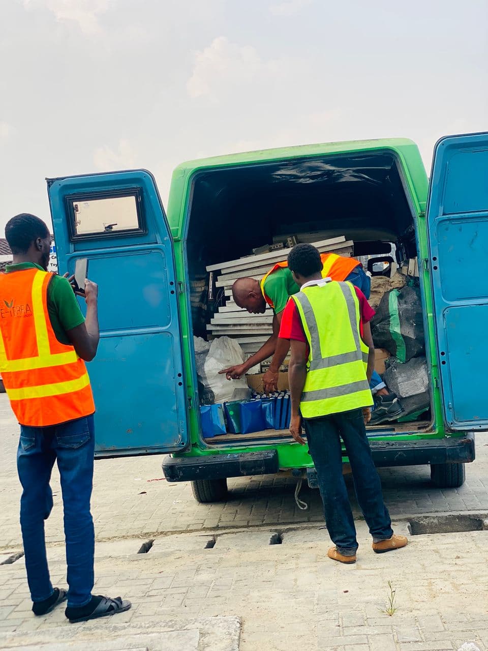 Workers loading recoverable electronic equipment for responsible processing.